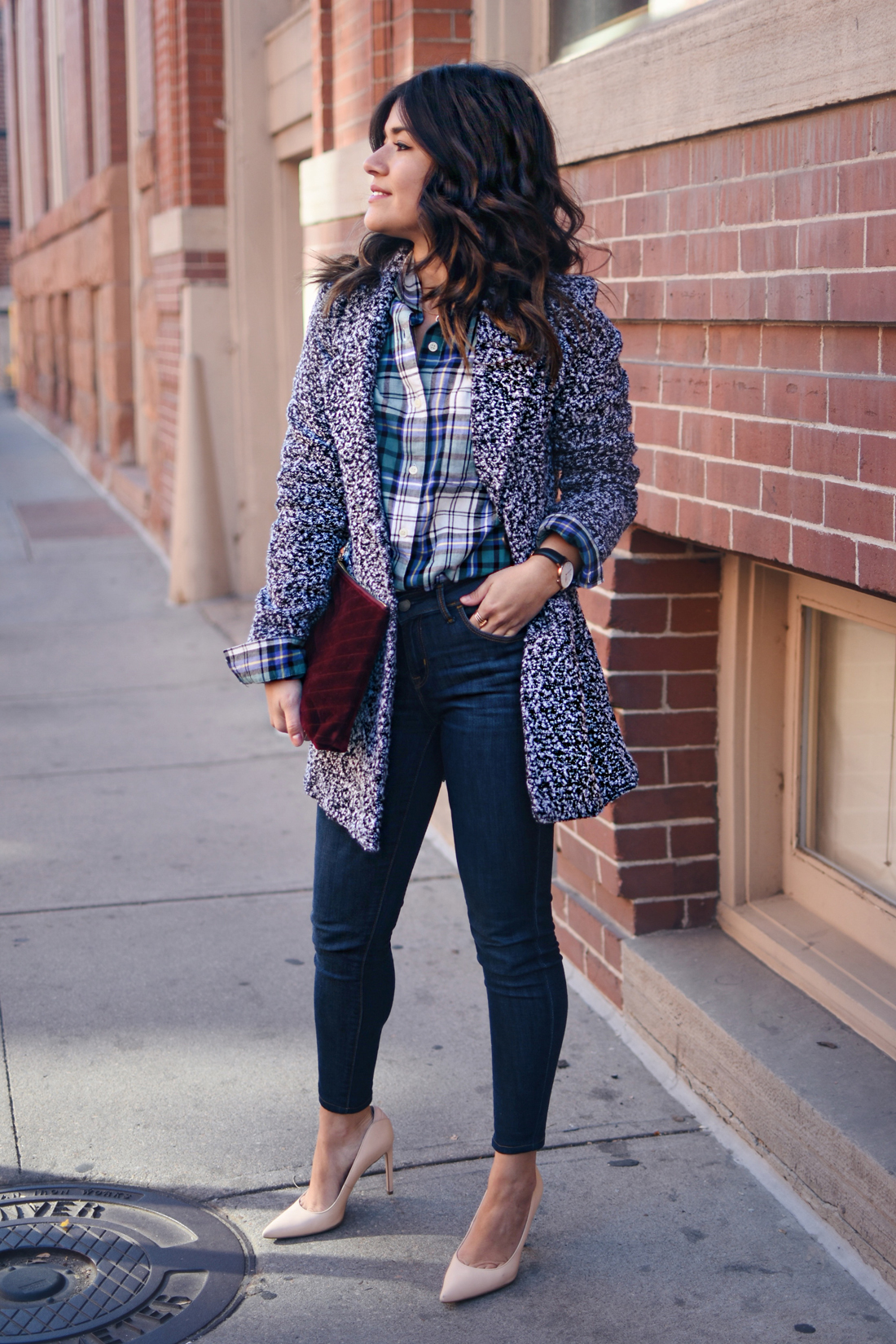 Carolina Hellal of Chic Talk wearing Old Navy rockstar skinny jeans, Dark grey coat, plaid top and Burgundy velvet clutch - STYLING OLD NAVY DENIM by popular Denver fashion blogger Chic Talk