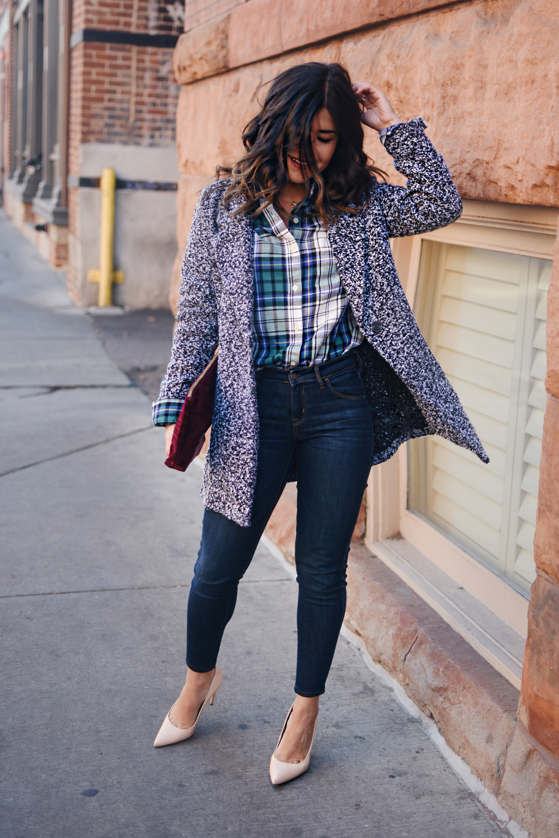 Carolina Hellal of Chic Talk wearing Old Navy rockstar skinny jeans, Dark grey coat, plaid top and Burgundy velvet clutch - STYLING OLD NAVY DENIM by popular Denver fashion blogger Chic Talk