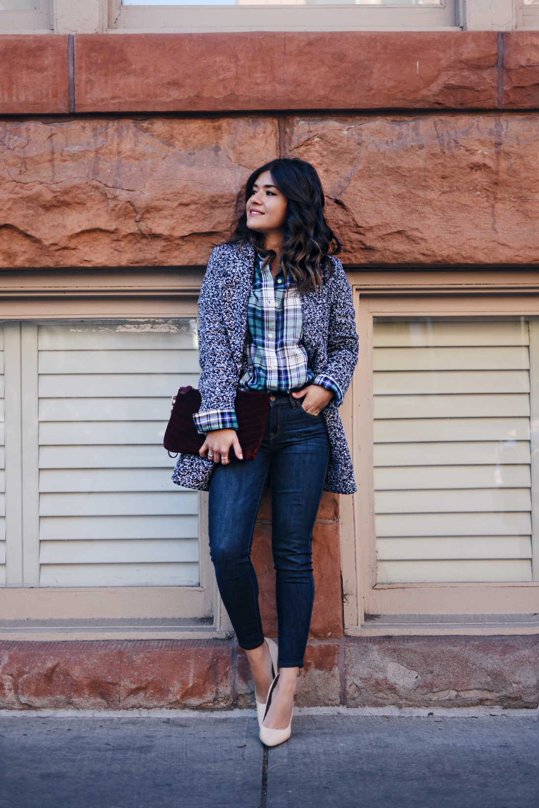 Carolina Hellal of Chic Talk wearing Old Navy rockstar skinny jeans, Dark grey coat, plaid top and Burgundy velvet clutch - STYLING OLD NAVY DENIM by popular Denver fashion blogger Chic Talk