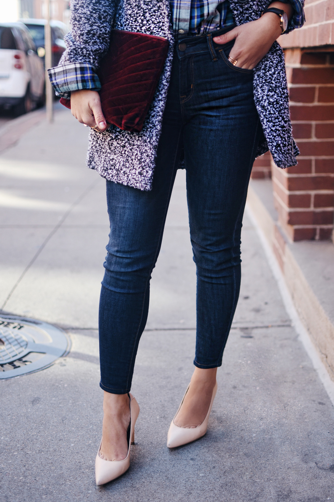 Carolina Hellal of Chic Talk wearing Old Navy rockstar skinny jeans, Dark grey coat, plaid top and Burgundy velvet clutch - STYLING OLD NAVY DENIM by popular Denver fashion blogger Chic Talk