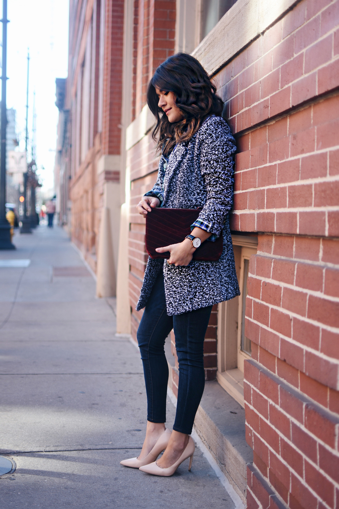 Carolina Hellal of Chic Talk wearing Old Navy rockstar skinny jeans, Dark grey coat, plaid top and Burgundy velvet clutch - STYLING OLD NAVY DENIM by popular Denver fashion blogger Chic Talk