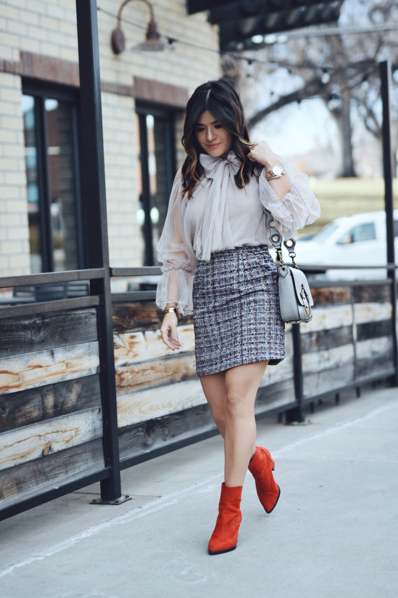 Carolina Hellal of Chic Talk wearing a Chiwish tulle top, Shein tweed skirt, shein gray coat, ASOS red boots and Rebecca Minkoff bag - CHICWISH TULLE TOP by popular Denver fashion blogger Chic Talk