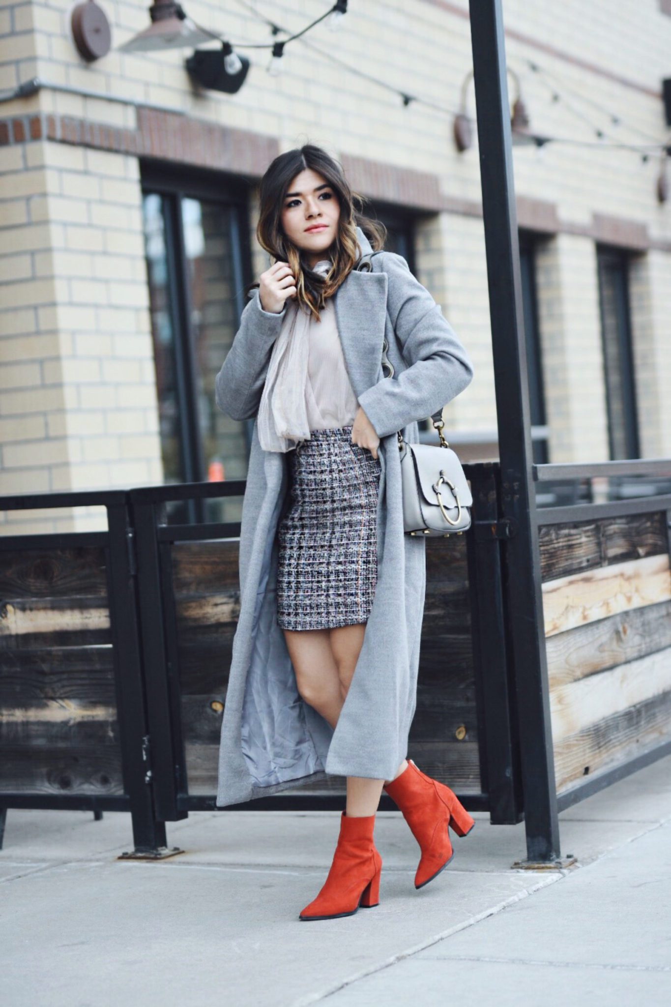 Carolina Hellal of Chic Talk wearing a Chiwish tulle top, Shein tweed skirt, shein gray coat, ASOS red boots and Rebecca Minkoff bag - CHICWISH TULLE TOP by popular Denver fashion blogger Chic Talk