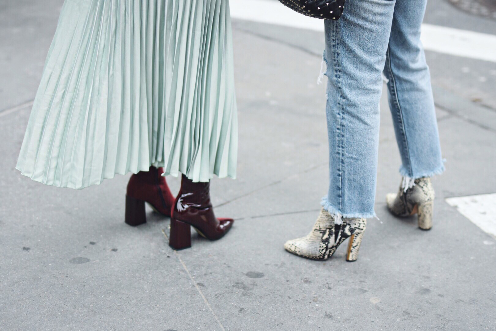 Carolina Hellal of Chic Talk wearing an H&M pleated skirt, Shein bomber jacket, Public Desire boots and Rebecca Minkoff bag - NYFW 2018 DAY 2 AND 3 by popular Denver fashion blogger Chic Talk