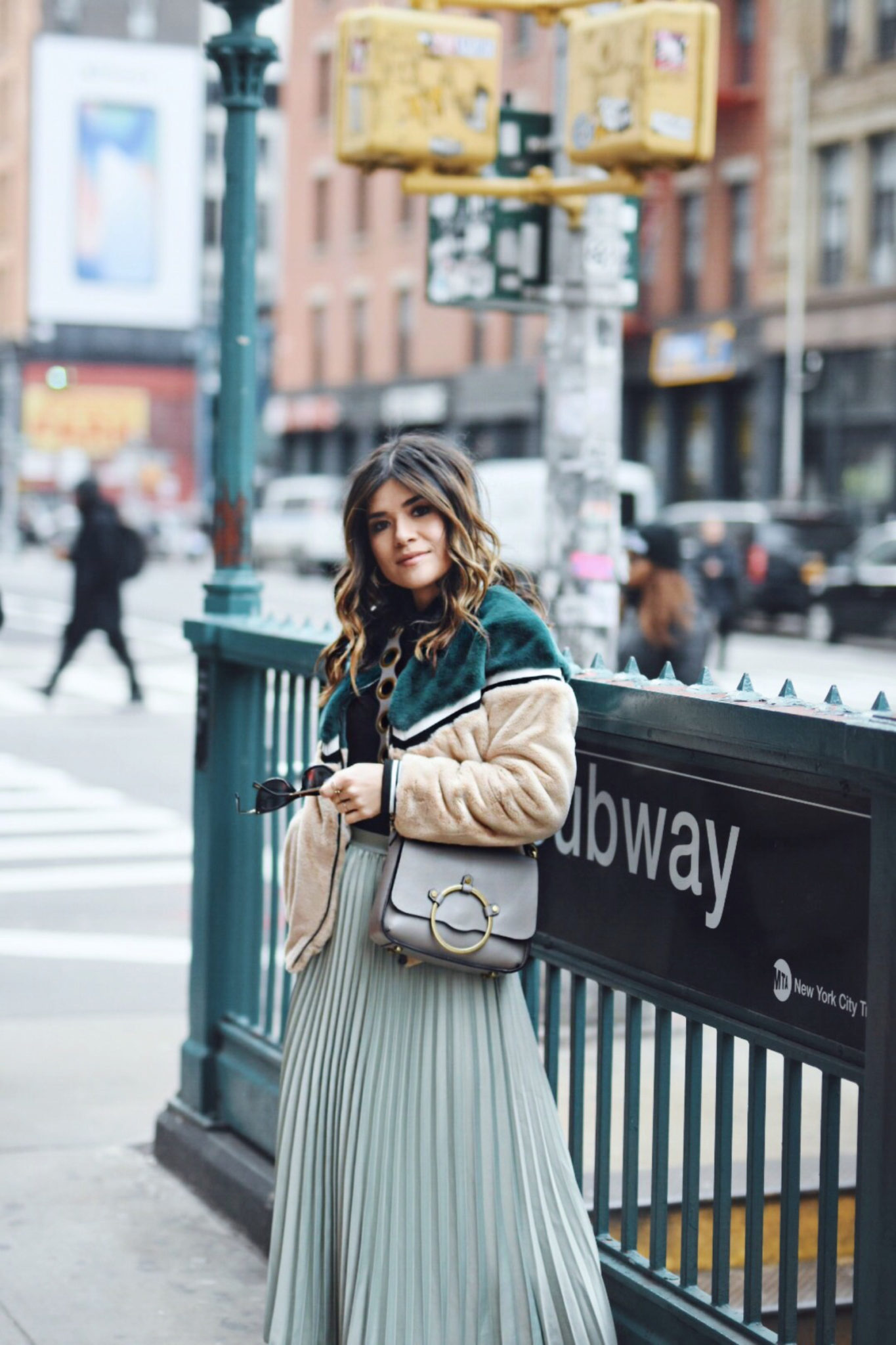 Carolina Hellal of Chic Talk wearing an H&M pleated skirt, Shein bomber jacket, Public Desire boots and Rebecca Minkoff bag - NYFW 2018 DAY 2 AND 3 by popular Denver fashion blogger Chic Talk