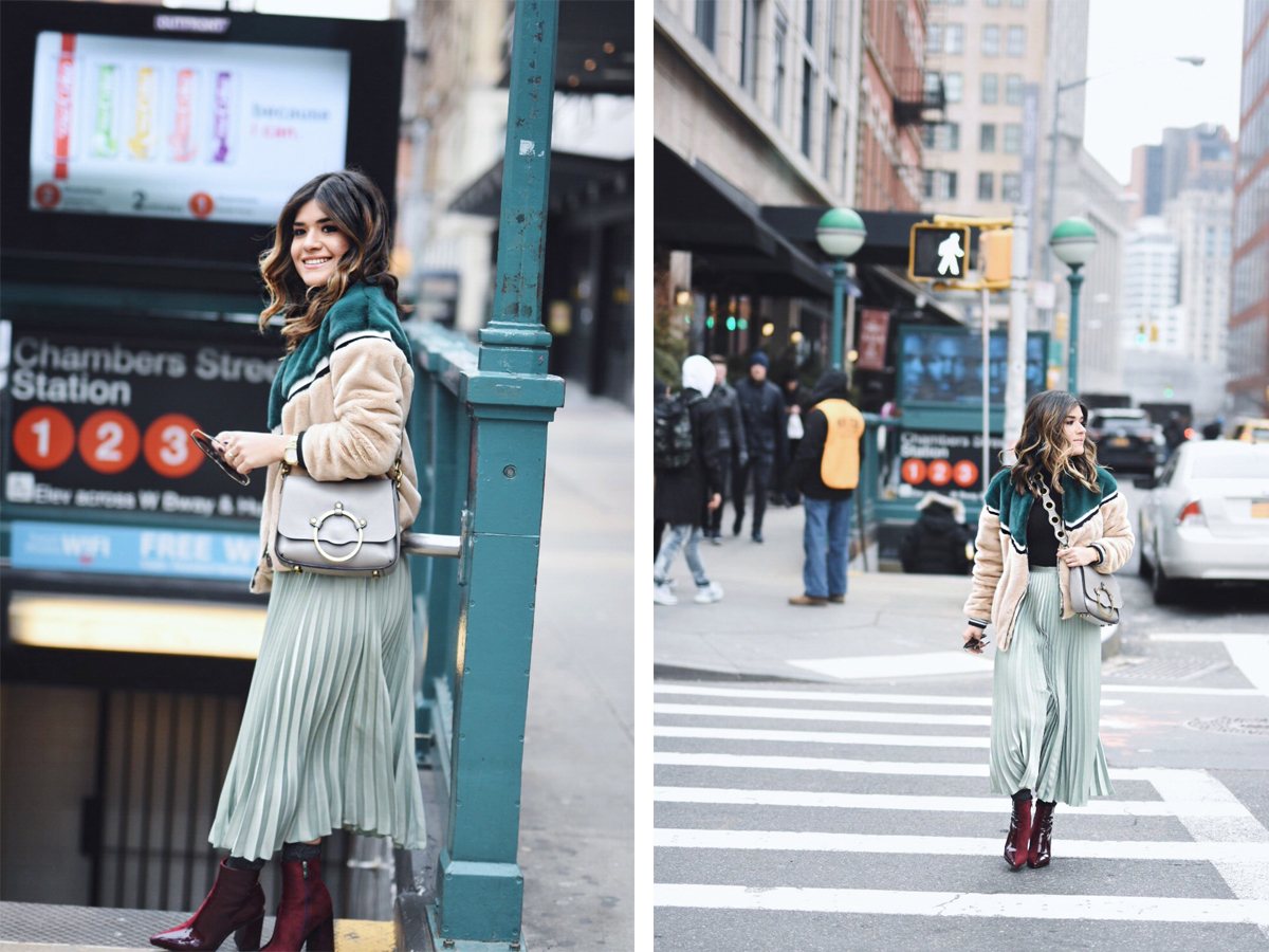 Carolina Hellal of Chic Talk wearing an H&M pleated skirt, Shein bomber jacket, Public Desire boots and Rebecca Minkoff bag - NYFW 2018 DAY 2 AND 3 by popular Denver fashion blogger Chic Talk