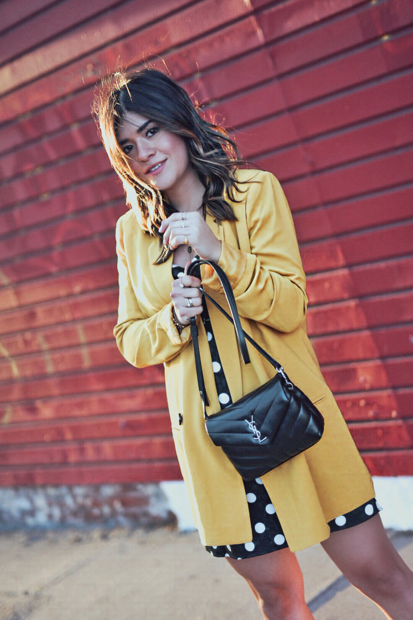 Carolina Hellal of Chic Talk wearing a Topshop polka dot dress, Mural yellow blazer, Sam Edelman sandals and YSL crossbody bag - Spring polka dot dress by popular Denver fashion blogger Chic Talk