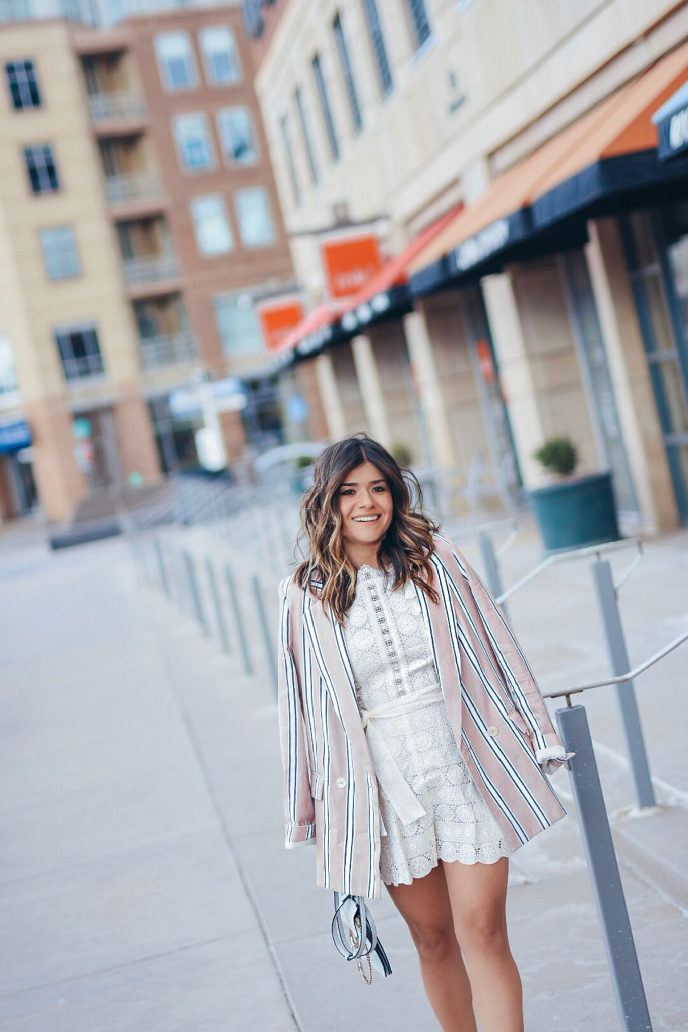 Carolina Hellal wearing a Zimmerman white romper, free people blazer, Sam Edelman nude pumps and Chloe bag