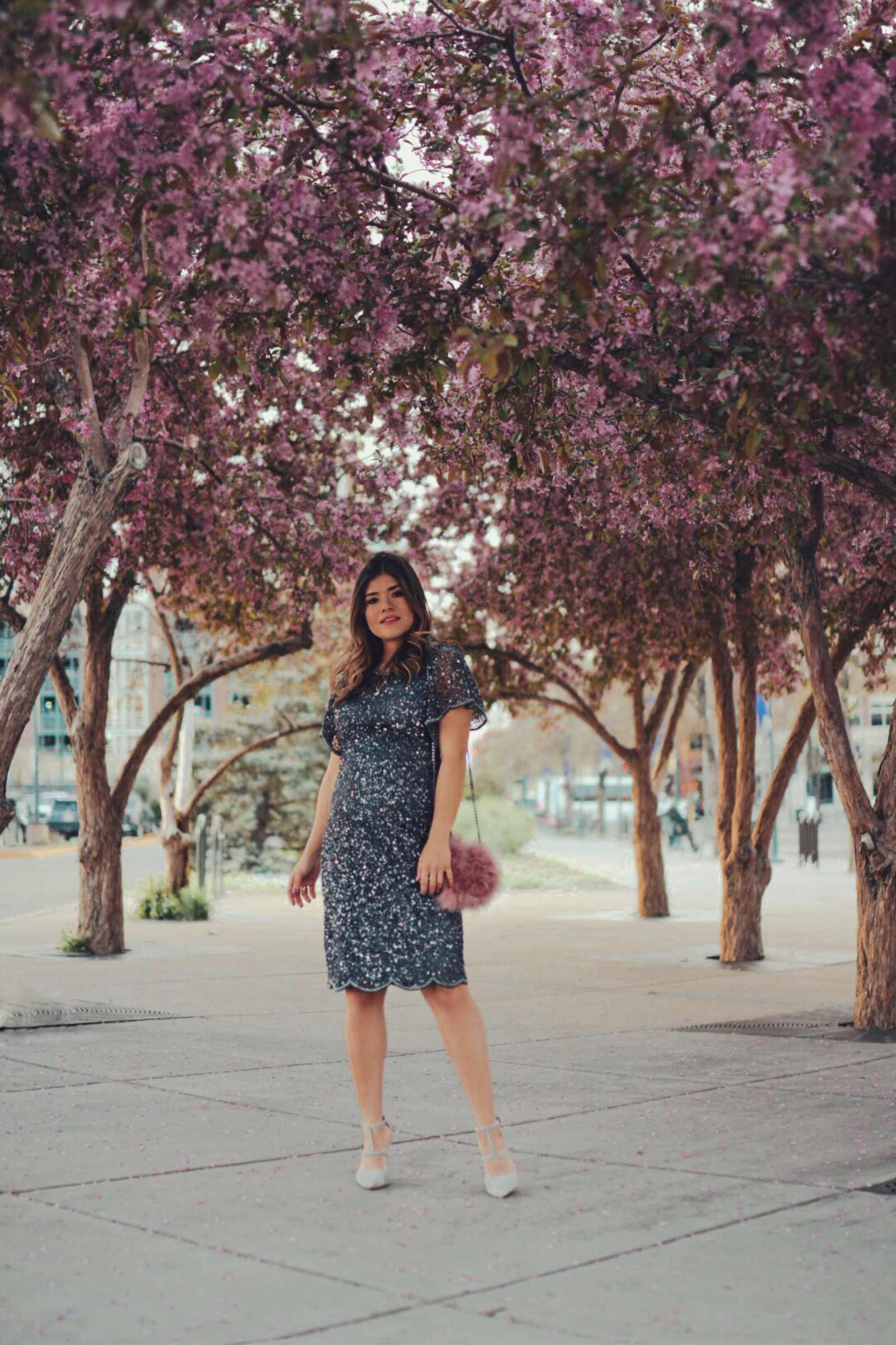 Carolina Hellal of Chic Talk wearing an Adrianna Papell beaded cocktail dress, Nine west grey shoes and topshop feather bag - ADRIANNA PAPELL DRESS styled by popular Denver fashion blogger, Chic Talk
