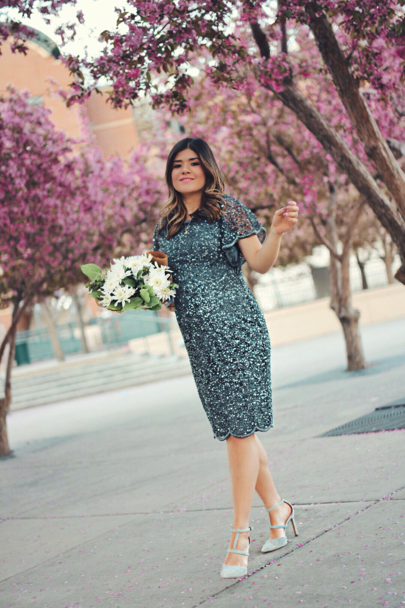 Carolina Hellal of Chic Talk wearing an Adrianna Papell beaded cocktail dress, Nine west grey shoes and topshop feather bag - ADRIANNA PAPELL DRESS styled by popular Denver fashion blogger, Chic Talk