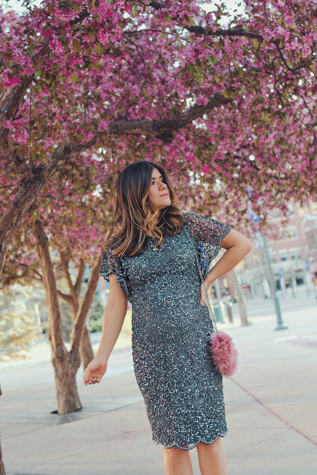 Carolina Hellal of Chic Talk wearing an Adrianna Papell beaded cocktail dress, Nine west grey shoes and topshop feather bag - ADRIANNA PAPELL DRESS styled by popular Denver fashion blogger, Chic Talk