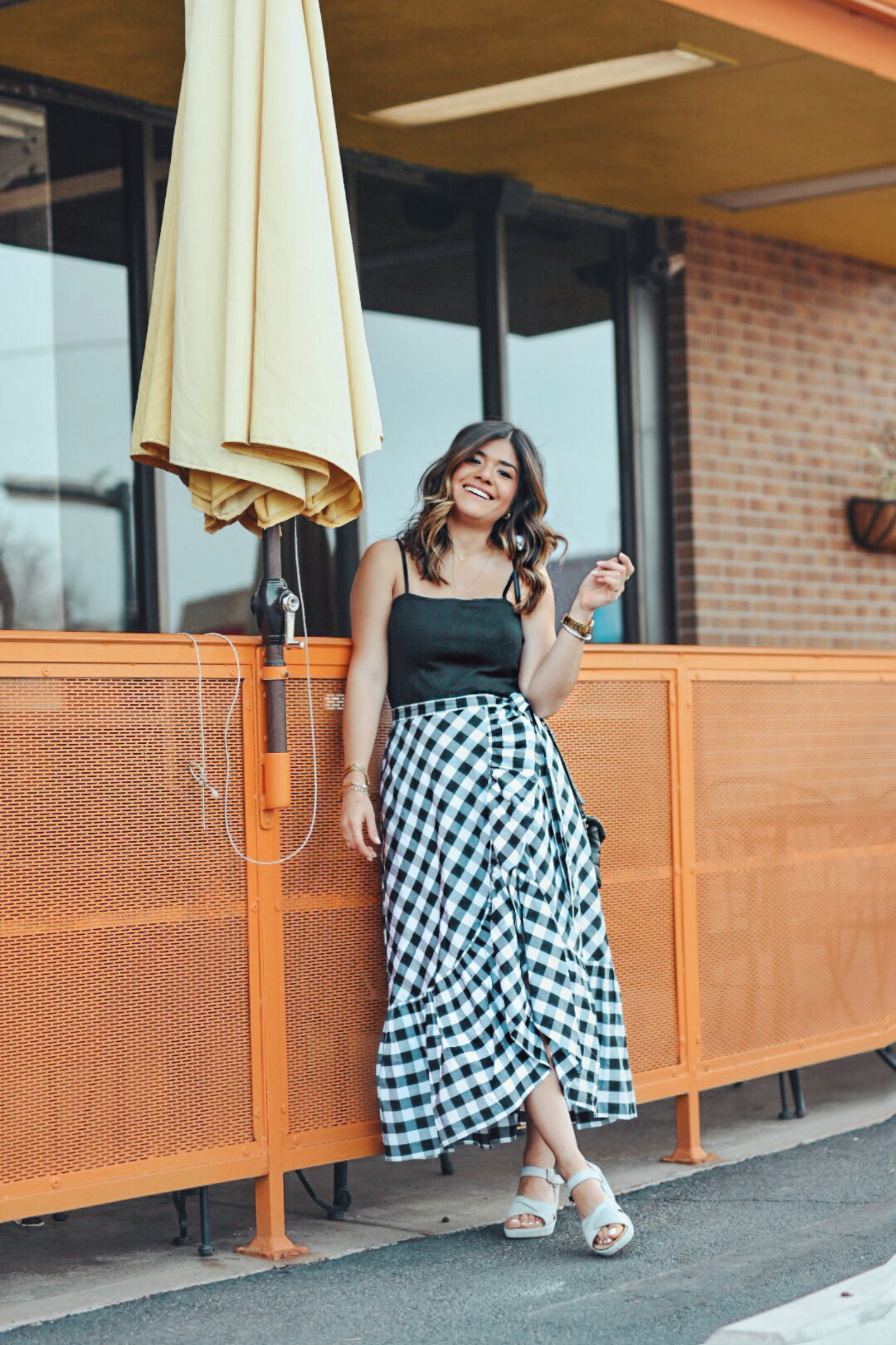 Carolina Hellal wearing Kork-Ease sandals, Jcrew gingham skirt, topshop black tank top and YSL Loulou Monogram XS Calf Leather Crossbody Bag - KORK EASE SANDALS styled by popular Denver fashion blogger Chic Talk 