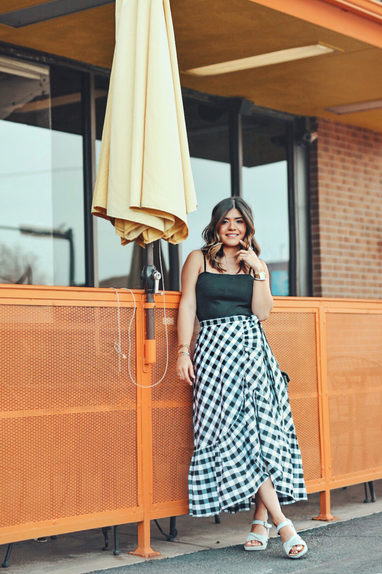 Carolina Hellal wearing Kork-Ease sandals, Jcrew gingham skirt, topshop black tank top and YSL Loulou Monogram XS Calf Leather Crossbody Bag - KORK EASE SANDALS styled by popular Denver fashion blogger Chic Talk  