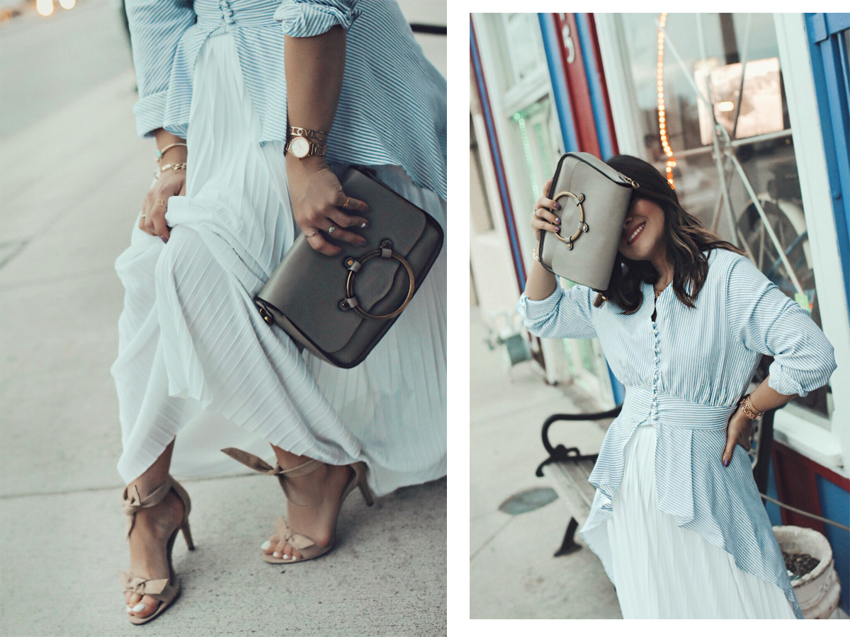 Carolina Hellal of Chic Talk wearing a Chicwish striped long top, a white midi skirt, and Vince Camuto sandals.
