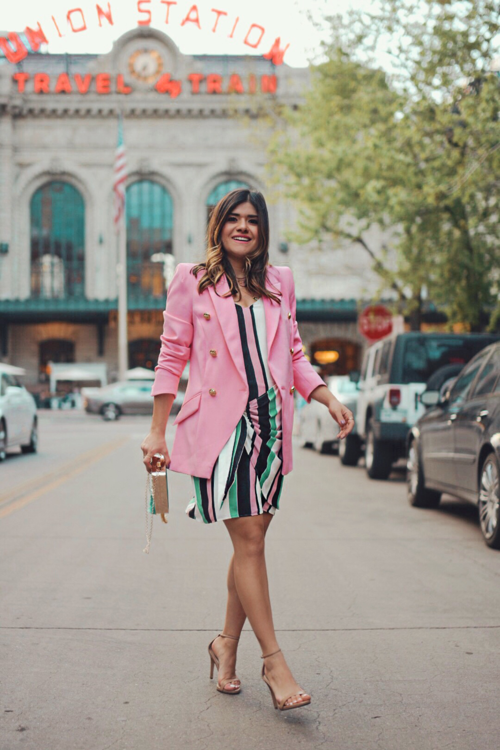 Carolina Hellal of Chic Talk wearing a River Island prink blazer, striped dress and green embellished clutch - THE ULTIMATE SPRING SHOPPING GUIDE by popular Denver fashion blogger, Chic Talk
