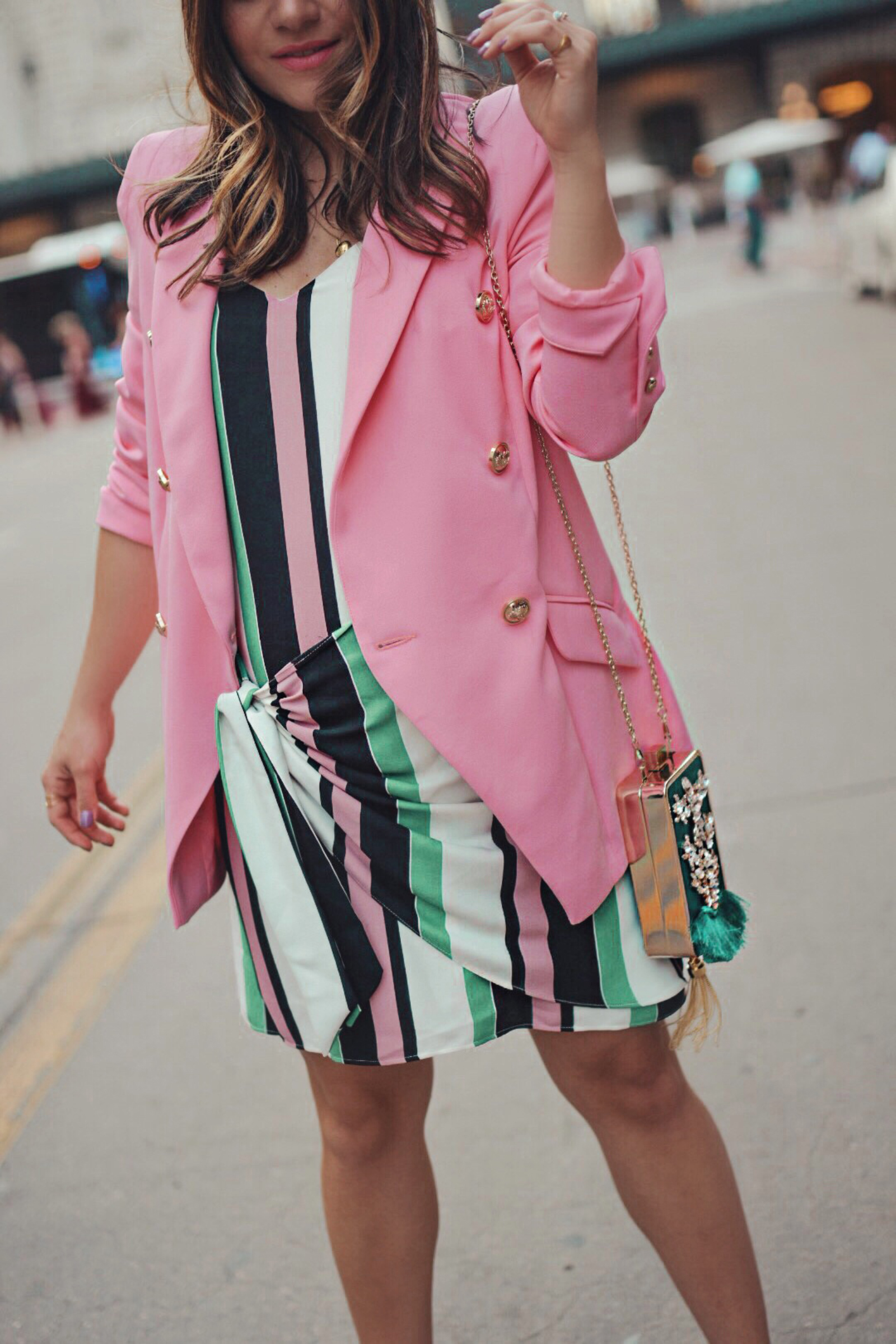 Carolina Hellal of Chic Talk wearing a River Island prink blazer, striped dress and green embellished clutch - THE ULTIMATE SPRING SHOPPING GUIDE by popular Denver fashion blogger, Chic Talk